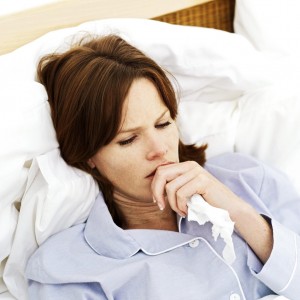 woman sick in bed