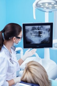 Dr._Peter_photo_dentist_and_patient-200×300