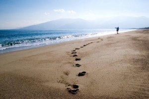 foot prints of person walking on beach