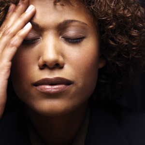 stressed woman with hand to forhead