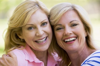 two mature women hugging