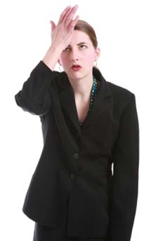 woman with hitting hand on forehead