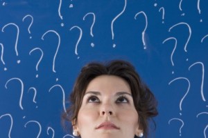 woman with questionmarks above her head