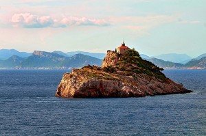 rocky island in middle of sea
