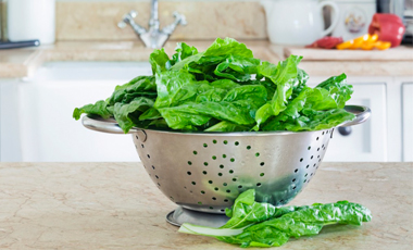 colander filled with greens