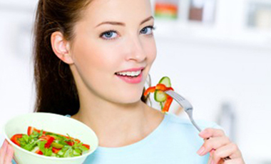 woman eating a salad