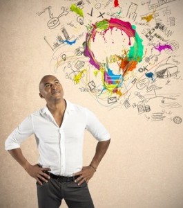 man looking up to artistic drawing represnting his ideas