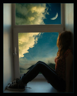 image of girl looking out window to night sky