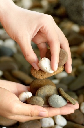 a hand filled with rocks