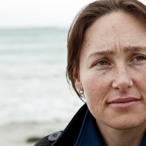 woman on beach sad expression