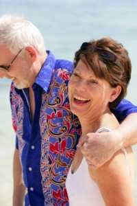 mature couple walking on beach