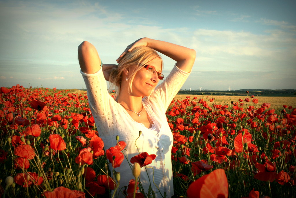 woman in field of flowers