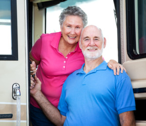 older couple in front of RV