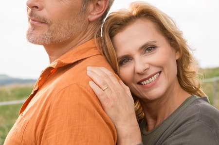 attractive mature woman leaning on husband