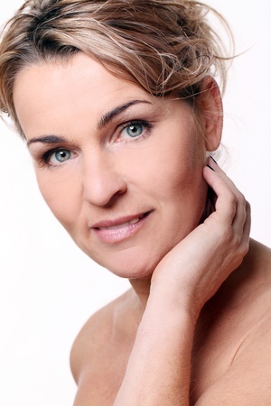 photo of woman bare shoulder with hand next to face