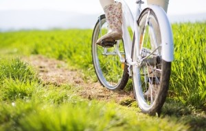 girl boots seen peddling bike