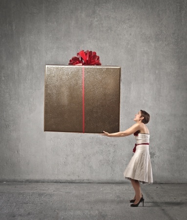woman holding huge heavy present