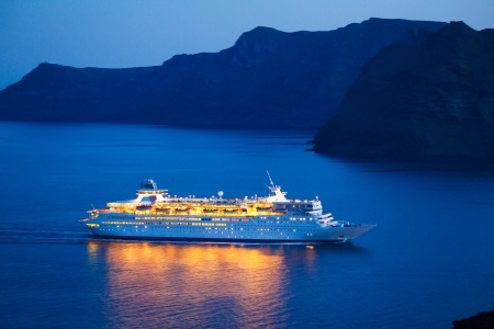 cruise ship at night in harbor