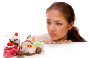 lady contemplating sweets
