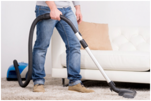man vacuuming 