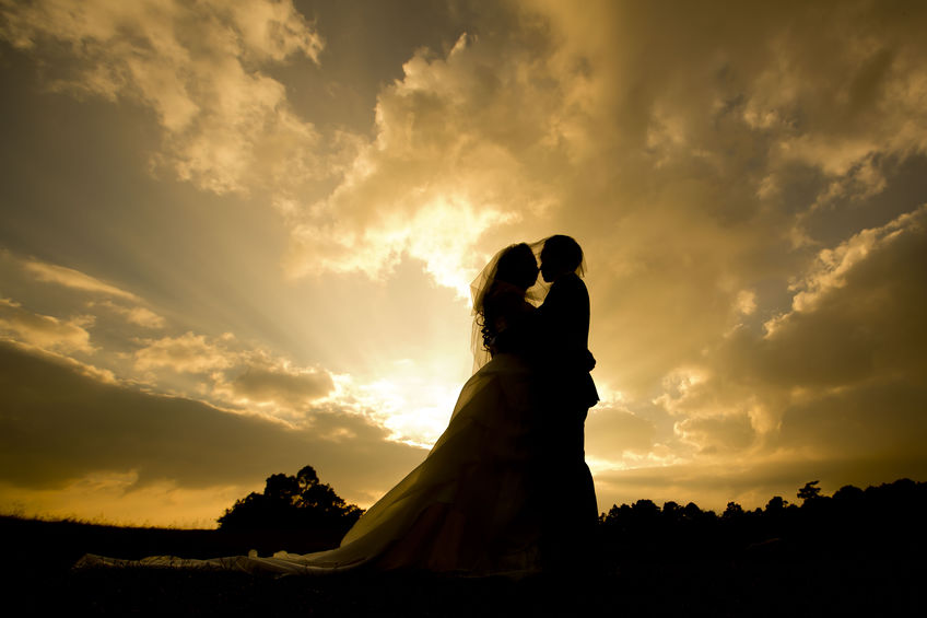 Silhouette wedding couple with the sunset